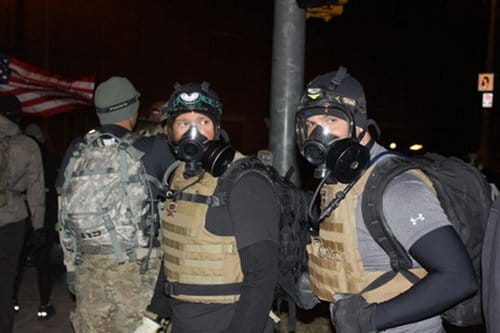 gasmaskguys Guys from Blue Line Tactical Fitness wear gas masks.